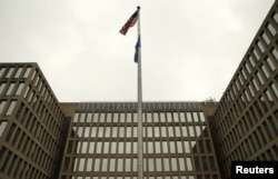 The U.S. national flag is pictured at the Office of Personnel Management building in Washington, June 5, 2015.