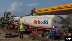 FILE - A tanker offloads fuel at a Petroda filling station in Lilongwe, Malawi, October 1, 2021. A trainload of diesel fuel arrived July 23, 2024, in Malawi for the first time in 21 years, signaling the end of shortages. 