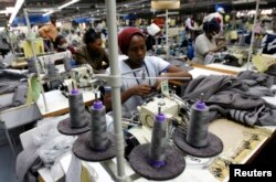 FILE - Kenyan workers prepare clothes for export at a factory in Athi River, near the Kenyan capital, Nairobi, July 31, 2009.