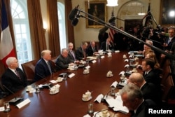 U.S. President Donald Trump speaks as he hosts an expanded bilateral meeting in the Cabinet Room with French President Emmanuel Macron (R, 3rd from bottom) and other officials at the White House in Washington, April 24, 2018.