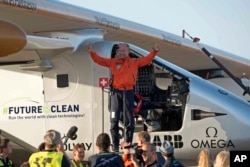 Pilot Bertrand Piccard, celebrates after landing the solar-powered plane at San Pablo airport in Seville, Spain Thursday, June 23, 2016.