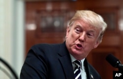President Donald Trump speaks during a news conference with Polish President Andrzej Duda in the East Room of the White House in Washington, Sept. 18, 2018.