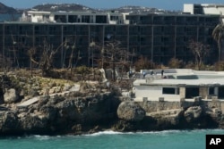 A damaged hotel stands after the passage of Hurricane Irma, close to the airport, in Phillipsburg, St. Martin, Sept. 11, 2017.
