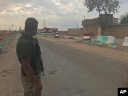 Iraqi security forces deploy in the village of Bashir, south of Kirkuk, Iraq, Oct. 13, 2017.