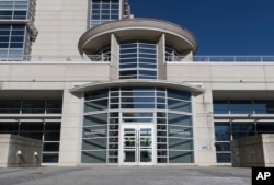 FILE - The entrance of the Dale and Betty Bumpers Vaccine Research Center is seen at the National Institutes of Health in Bethesda, Md.