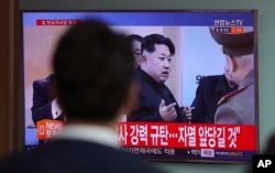 A man watches a TV news program showing a file footage of North Korean leader Kim Jong Un, at Seoul Train Station in Seoul, South Korea, Wednesday, April 5, 2017.