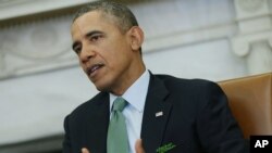 President Barack Obama makes a statement to reporters about Ukraine during his meeting with Irish Prime Minister Enda Kenny in the Oval Office, March 14, 2014.