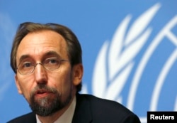 FILE - Jordan's Prince Zeid Ra'ad al-Hussein, U.N. High Commissioner for Human Rights, pauses during a news conference at the United Nations European headquarters in Geneva, Oct. 16, 2014.