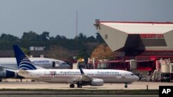 FILE - Aircraft taxi at the international terminal of Jose Marti Airport in Havana, Cuba, Feb. 14, 2016. Earlier this year, two French construction companies were selected to renovate the ageing airport.