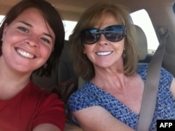FILE - This undated handout photo shows 26-year-old Kayla Mueller(L) and her mother Marsha Mueller.
