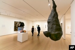 Louise Bourgeois' "The Quartered One," right, hangs in the Robert B. Menschel Gallery at the Museum of Modern Art in New York, June 2, 2017.