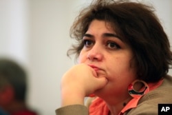 FILE - Khadija Ismayilova, a reporter for Radio Free Europe/Radio Liberty, is serving a seven-year prison sentence in Azerbaijan..