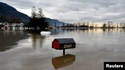 Flood water is seen a week after rainstorms lashed the western Canadian province of British Columbia, triggering landslides and floods, and shutting highways, in Abbottsford, British Columbia, Canada, Nov. 22, 2021.