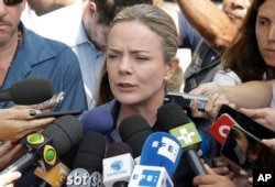 Worker's Party President and Brazilian Sen. Gleisi Hoffmann, speaks with journalists after meeting with former President Luiz Inacio Lula da Silva at the Lula Institute in Sao Paulo, Brazil, April 5, 2018.
