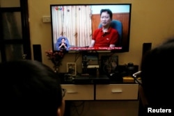 FILE - Viewers watch state-run Vietnam Television on Aug. 3, 2017. Under media restructuring in 2025, Vietnam Television will be the sole national TV channel.