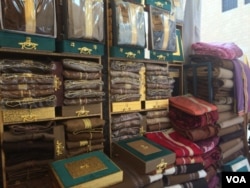 Enjoying the relative peace and prosperity selling men's clothes in Riyadh, some Yemeni workers say they, too, believe Iran is funding and providing weapons for Houthi militants fighting in Yemen, Jan. 26, 2016. (H. Murdock/VOA)