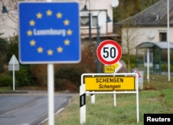 A street sign marks the beginning of Schengen, Luxembourg, January 27, 2016. The Schengen Agreement with the goal to illiminate internal border controls was signed on June 14, 1985 in the small village at the river Moselle and the tripoint of France, Germany and the Netherlands.