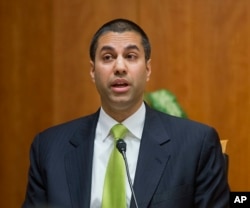FILE - Federal Communication Commission Commissioner Ajit Pai speaks during a hearing in Washington.