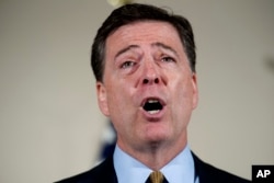 FILE - FBI Director James Comey makes a statement at FBI Headquarters in Washington regarding its investigation into Hillary Clinton's use of a private email server while secretary of state.