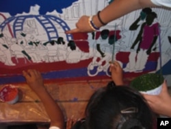 Tony Ortega takes part in visiting artist programs and recently enlisted children to help him create a wall-sized mural about their neighborhood.
