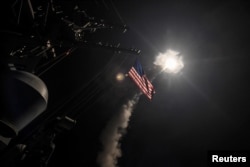 FILE - U.S. Navy guided-missile destroyer USS Porter (DDG 78) conducts strike operations while in the Mediterranean Sea which U.S. Defense Department said was a part of cruise missile strike against Syria, April 7, 2017.