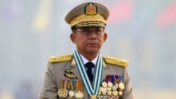 FILE - Myanmar's junta chief Senior General Min Aung Hlaing, who ousted the elected government in a coup, presides at an army parade on Armed Forces Day in Naypyitaw, March 27, 2021.