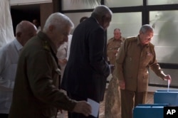 FILE - In this Dec. 27, 2016 file photo, Cuba's President Raul Castro casts his vote to elect a new member of the state council, the biannual legislative session at the National Assembly in Havana, Cuba.