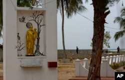 Sri Lankan soldiers stand guard outside St. Joseph's church in Thannamunai, Sri Lanka, April 30, 2019.
