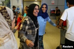 Hanadi Al-Hai, right, welcomes her mother traveling from Jordan on a Yemeni passport following the reinstatement by the U.S. Supreme Court of portions of President Donald Trump's executive order targeting travelers from six predominantly Muslim countries in Los Angeles, California, June 29, 2017.