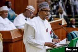 FILE - Nigeria's President Muhammadu Buhari presents the 2019 budget at the National Assembly in Abuja, Nigeria, Dec. 19, 2018.