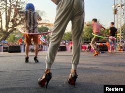 Performers hula hoop at a contest of the Drag Olympics at Yangon Pride festival in Yangon, Myanmar, January 27, 2019.