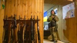 A Ukrainian female soldier takes a rest near a fighting position on the line of separation from pro-Russian rebels, Donetsk region, Ukraine, Dec 30, 2021. Presidents Joe Biden and Vladimir Putin spoke by phone on Thursday about the Russian troop buildup near Ukraine.