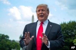 President Donald Trump speaks to reporters on the South Lawn before leaving the White House in Washington, May 20, 2019.