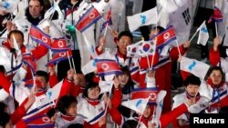 Athletes from North Korea and South Korea during the closing ceremonies of the 2018 Winter Olympics in Pyeongchang, South Korea, February 25, 2018