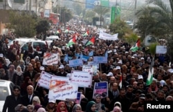 Employees of United Nations Relief and Works Agency (UNRWA) take part in a protest against a U.S. decision to cut aid, in Gaza City, Jan. 29, 2018.