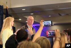 Republican Greg Gianforte greets supporters at a hotel ballroom after winning Montana's sole congressional seat, May 25, 2017, in Bozeman, Mont. In his speech, Gianforte apologized for a altercation at his campaign headquarters with a reporter on the eve