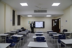 A teacher records an online class at school, following the outbreak of the coronavirus disease (COVID-19) in the holy city of Karbala, Iraq March 26, 2020. (REUTERS/Abdullah Dhiaa Al-Deen)