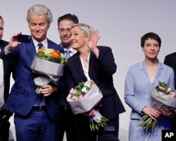 AfD (Alternative for Germany) chairwoman Frauke Petry, right, Far-right leader and candidate for next spring presidential elections Marine le Pen from France, center, and Dutch populist anti-Islam lawmaker Geert Wilders stand together after their speeches at a meeting of European Nationalists in Koblenz, Germany, Saturday, Jan. 21, 2017.