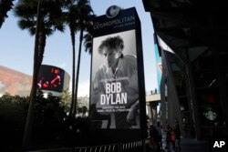 A sign outside of the Cosmopolitan of Las Vegas congratulates Bob Dylan, Oct. 13, 2016, after he won the 2016 Nobel Prize in literature.
