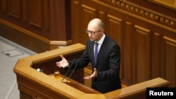 Ukrainian Prime Minister Arseniy Yatsenyuk addresses parliament in Kyiv July 24, 2014.