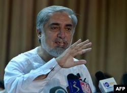 Afghan presidential candidate Abdullah Abdullah speaks at a press conference at his residence in Kabul, July 6, 2014.