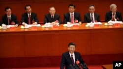 FILE - Chinese President Xi Jinping delivers a speech during the opening session of China's 19th Party Congress at the Great Hall of the People in Beijing, Oct. 18, 2017.