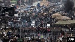 People visit makeshift memorials to the victims of the recent clashes in central Kiyv on February 23, 2014.