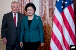 Secretary of State Rex Tillerson welcomes Chinese Vice Premier Liu Yandong during a working breakfast at the State Department, Sept. 28, 2017, in Washington.