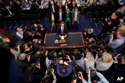 Facebook CEO Mark Zuckerberg prepares to testify before a joint hearing of the Senate Commerce and Judiciary Committees on Capitol Hill in Washington, April 10, 2018.