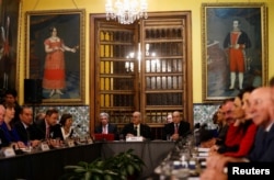 Peru's Foreign affair minister Ricardo Luna, center, and foreign affairs ministers and representatives from across the Americas meet to discuss issues related to the Venezuelan crisis, in Lima, Peru, Aug. 8, 2017.