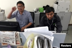 Reuters journalists Wa Lone, left, and Kyaw Soe Oo, who are based in Myanmar, pose for a picture at the Reuters office in Yangon, Myanmar, Dec. 11, 2017.