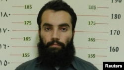 Anas Haqqani, a senior leader of the Haqqani network, arrested by the Afghan Intelligence Service (NDS) in Khost province is seen in this handout picture released Oct. 16, 2014.
