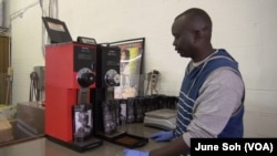 Manyang Kher, Founder of 734 Coffee, grinds coffee at his warehouse in Springfield, VA photo by June Soh.