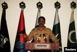 FILE - Major General Asif Ghafoor, director general of Inter-Services Public Relations (ISPR), speaks during a news conference in Rawalpindi, Pakistan, April 17, 2017.